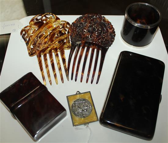 2 pierced tortoiseshell hair combs, 2 tortoiseshell cigarette cases, similar white metal-mounted pot & a dashboard St Christopher medal